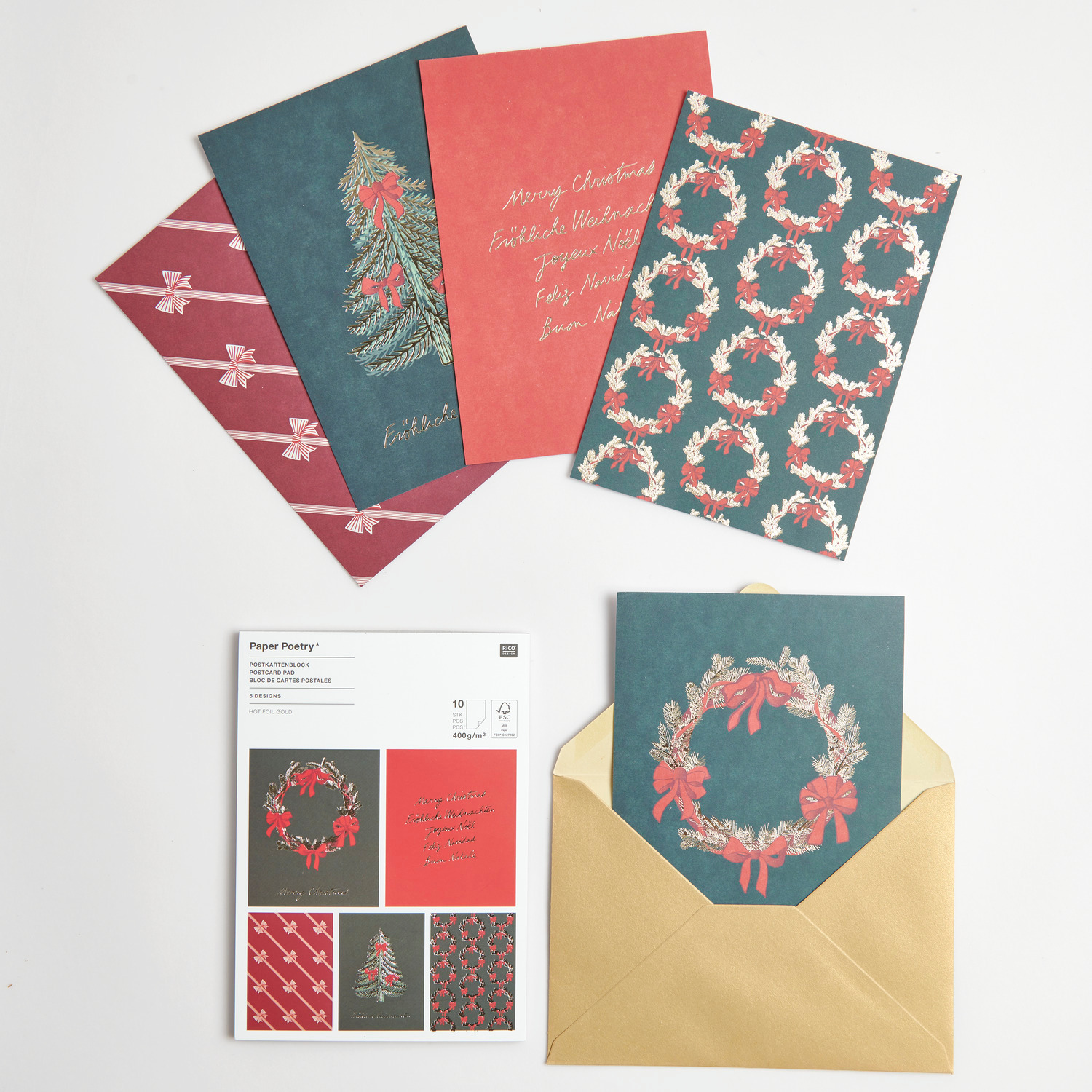 Paper Poetry Postkartenblock Schleifen Classic zeigt festliche Designs in Rot und Grün.