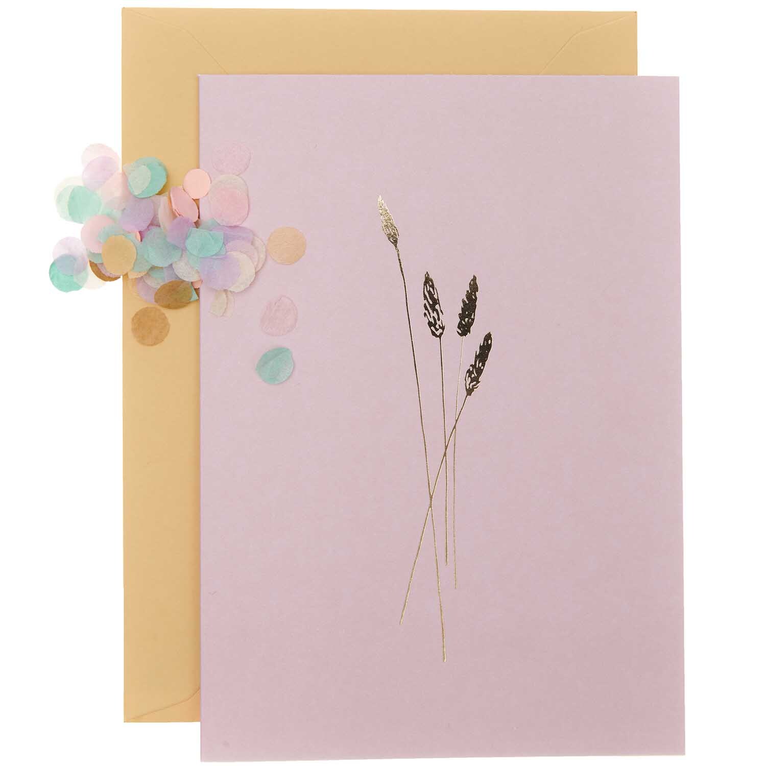 Paper Poetry Grußkartenset Transformation rosa zeigt eine rosa Karte mit goldenen Ähren und buntem Konfetti.