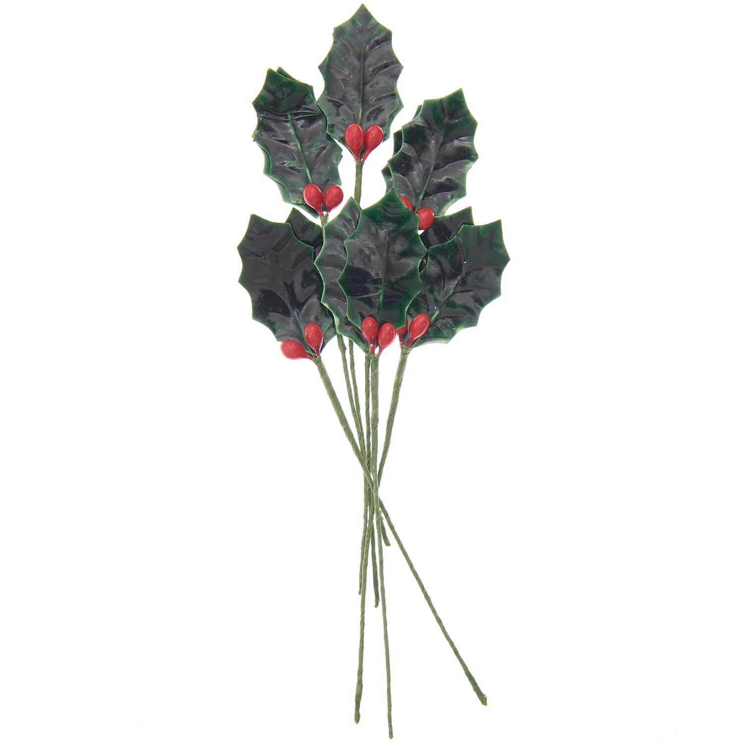 Picker Ilex 17cm 6 Stück von Rico Design zeigt grüne Stechpalmenzweige mit roten Beeren. Ideal für Dekorationen.