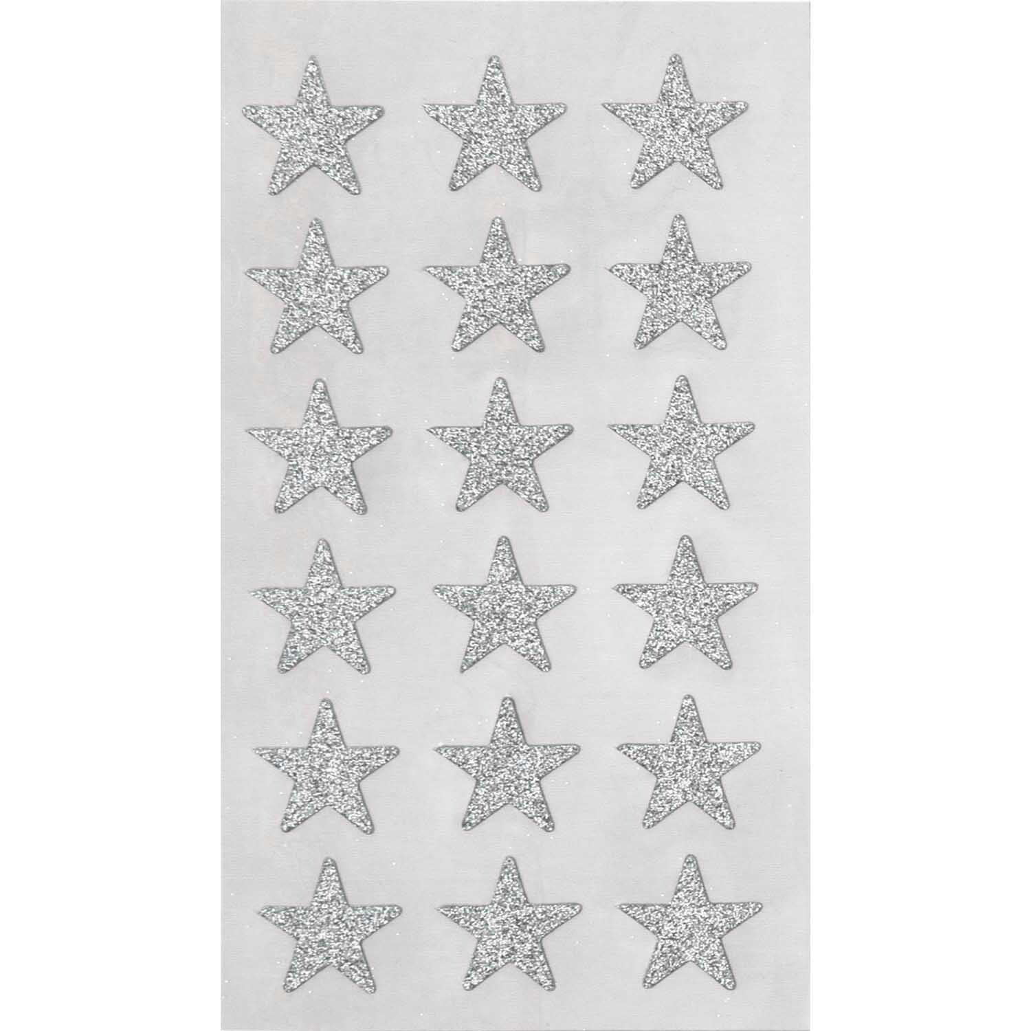Paper Poetry Sticker mit silbernen Glitzersternen von Rico Design auf vier Blättern. Ideal für kreative Projekte.