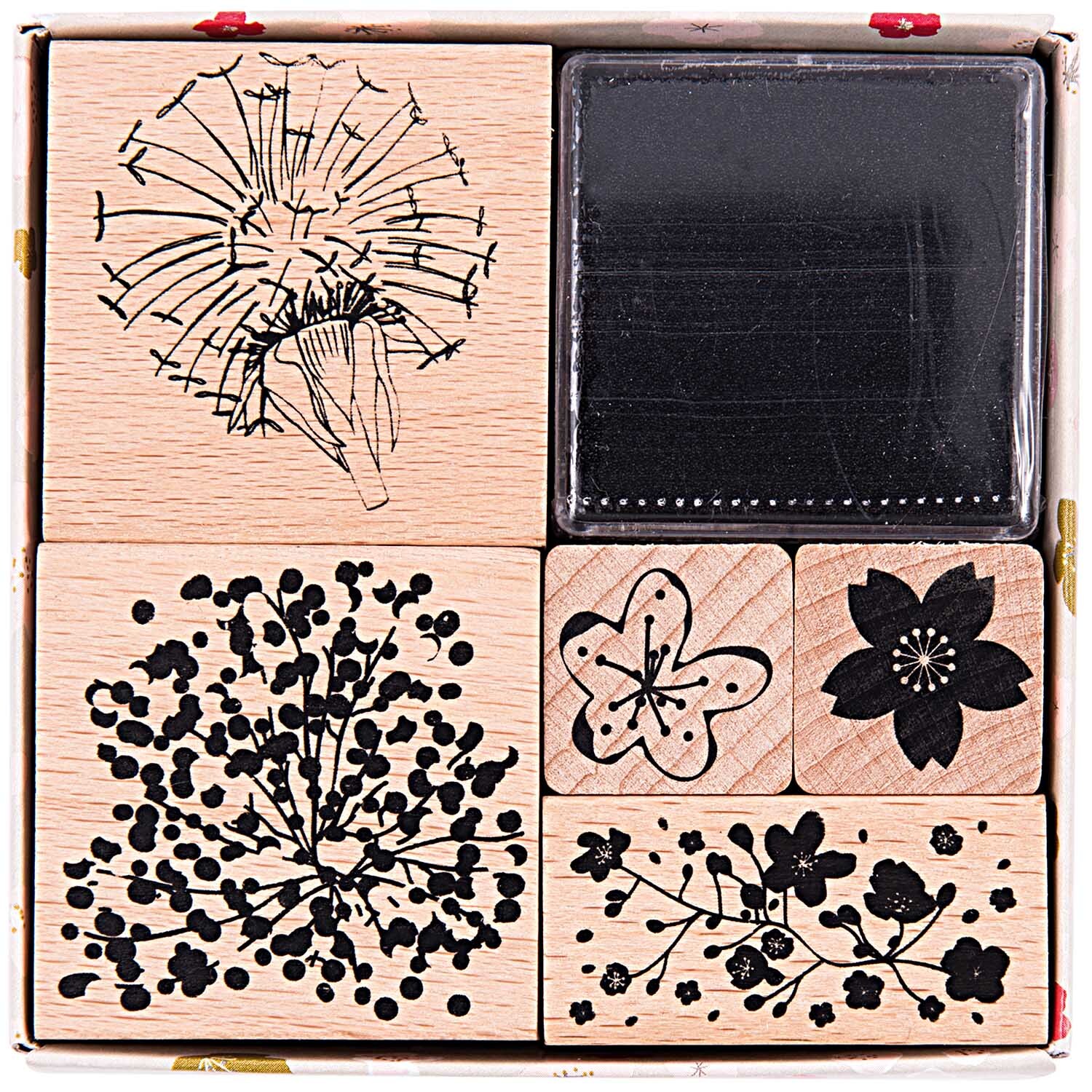 Paper Poetry Stempelset Bouquet Sauvage: Sechs schwarze Stempel mit floralen Motiven von Rico Design.