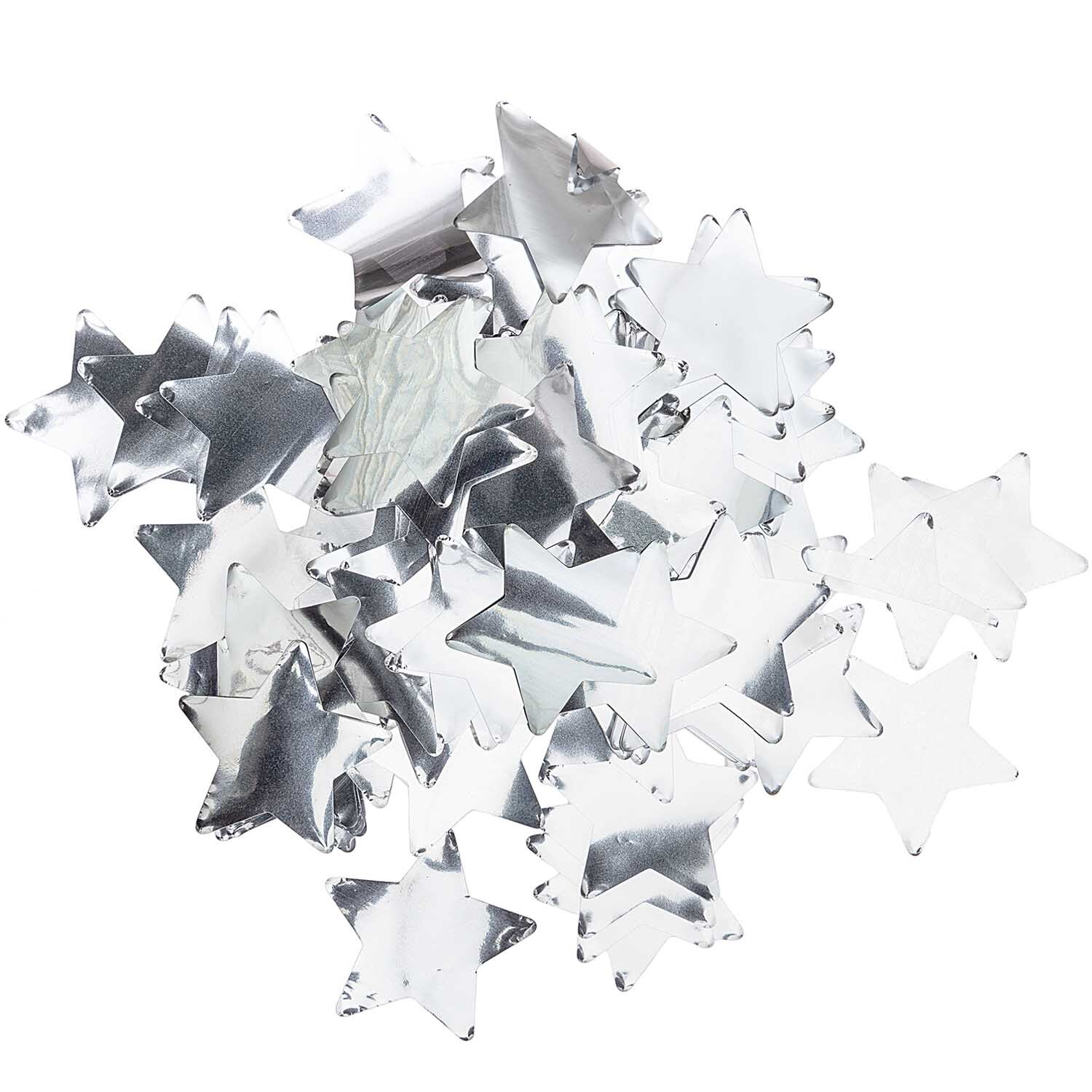 Flitter Sterne silber 50g von Rico Design. Silberne Sternkonfetti auf weißem Hintergrund, ideal für Dekorationen.
