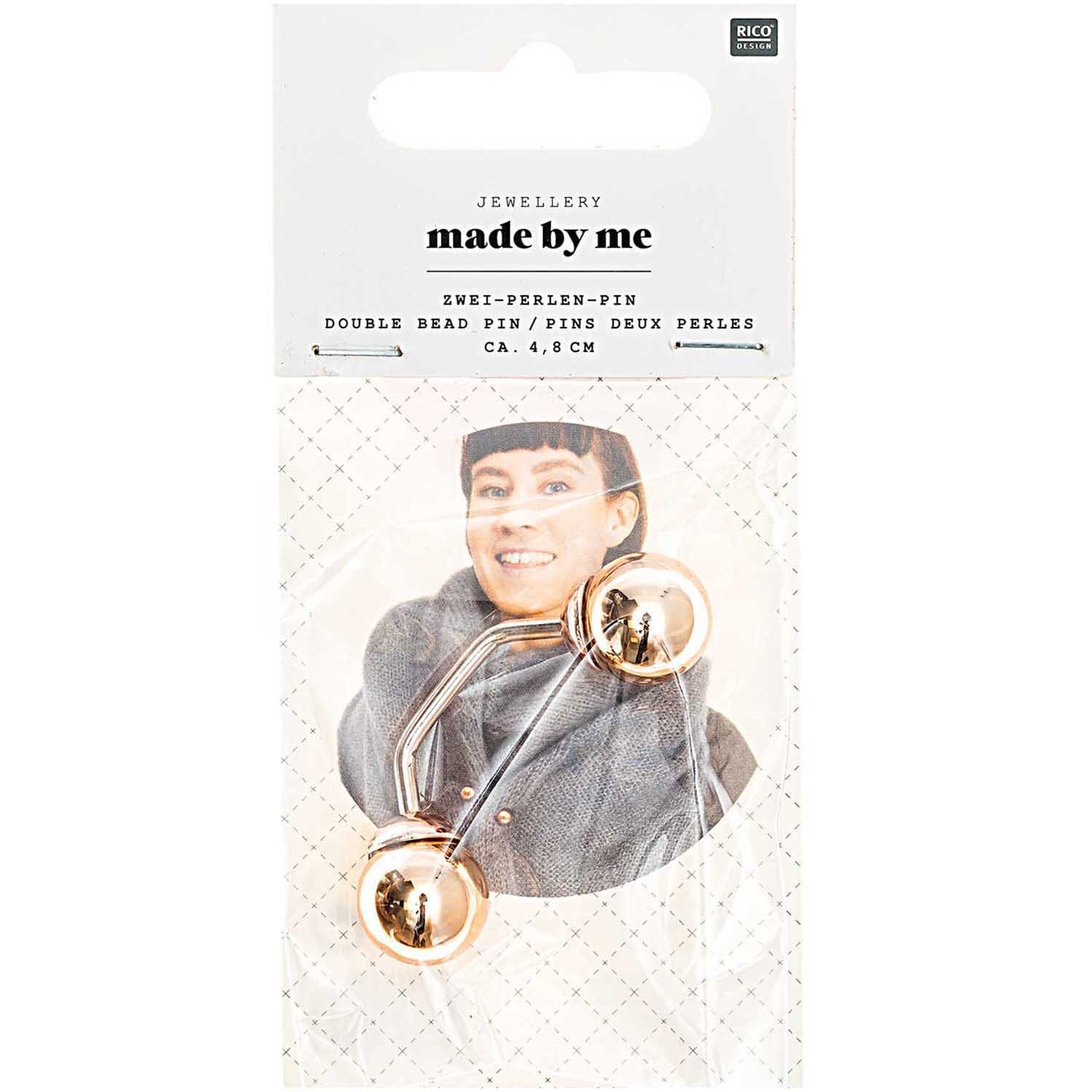 Zwei-Perlen-Pin 48mm 1 Stück Farbe Roségold von Rico Design Zwei-Perlen-Pin 48mm in Roségold von Rico Design, präsentiert auf einer Verpackung mit Model.