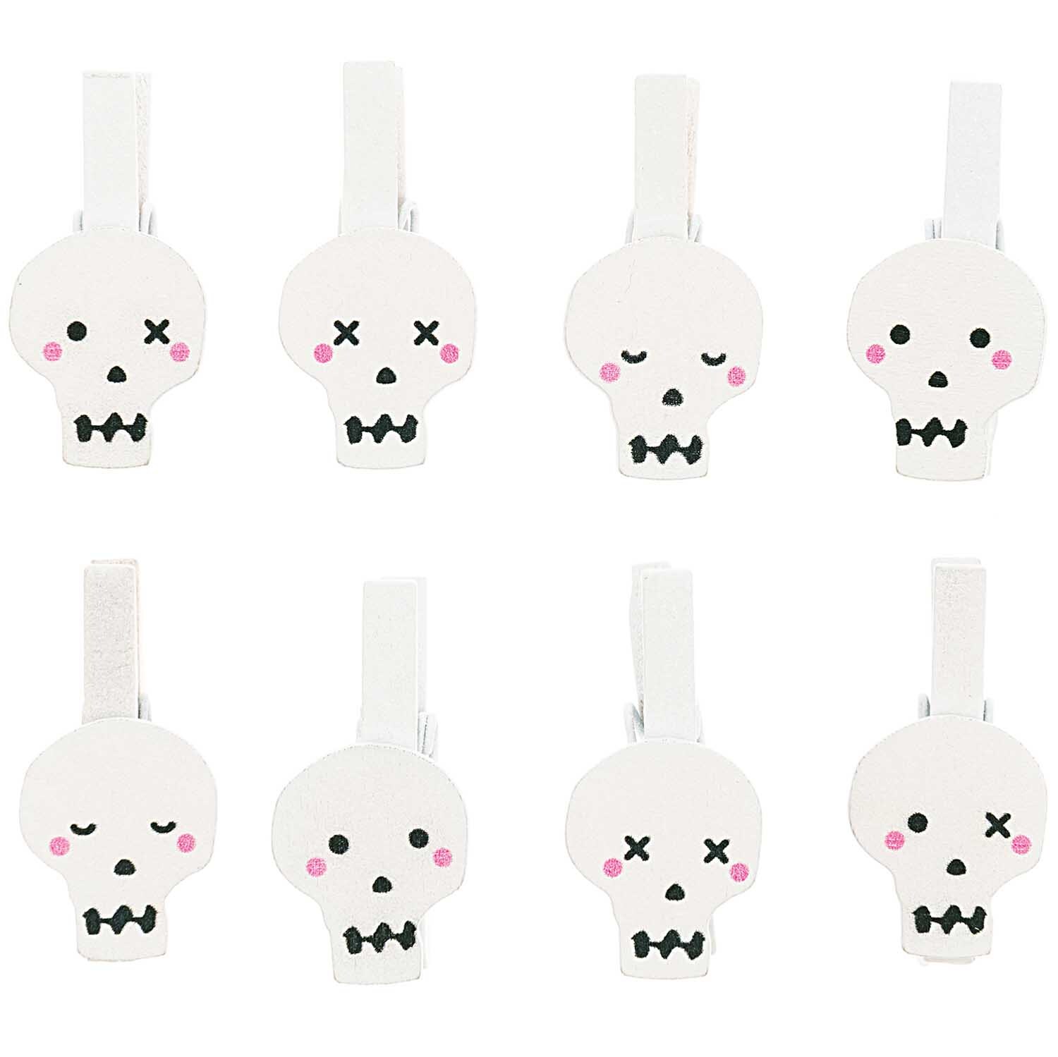 Holzclips Totenkopf Mix weiß 8 Stück von Rico Design: Weiße Clips mit Totenkopf-Design, ideal für kreative Dekorationen.