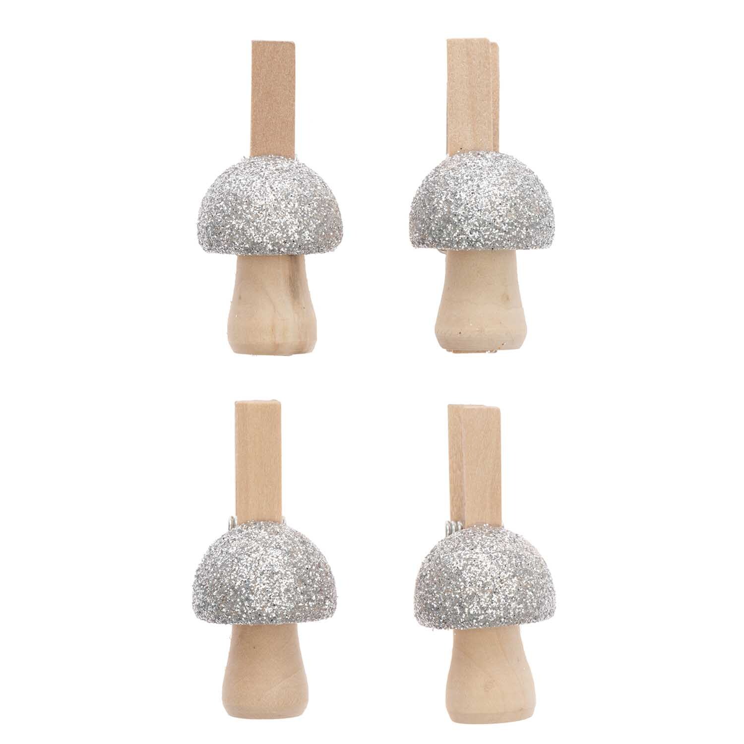 Dekoklammern Pilz mit Glitter in Silber von Rico Design, 4 Stück, zeigen glitzernde Pilzformen auf Holzklammern.
