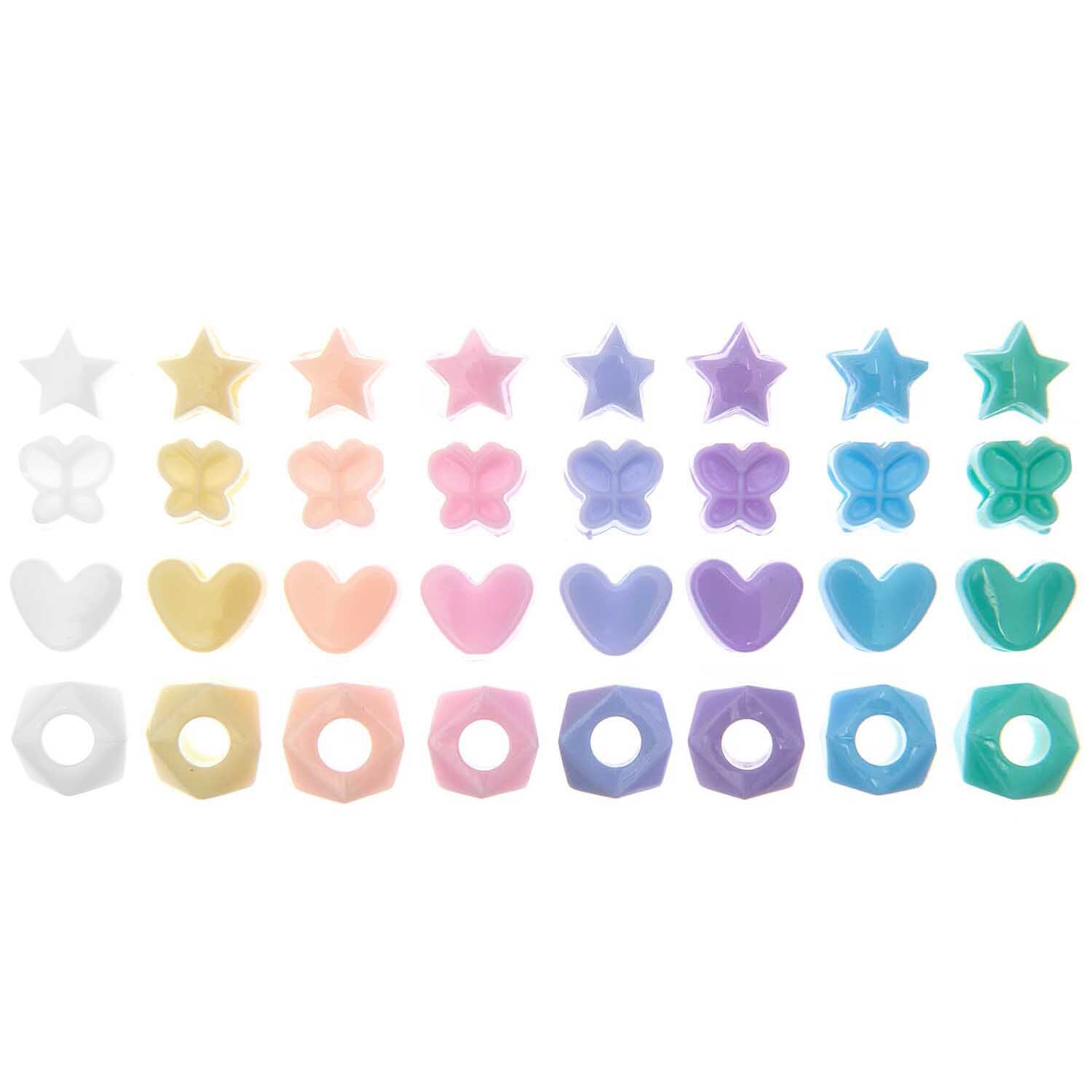Itoshii - Ponii Beads Formmix zeigt pastellfarbene Perlen in Stern-, Herz- und Blumenformen von Rico Design.