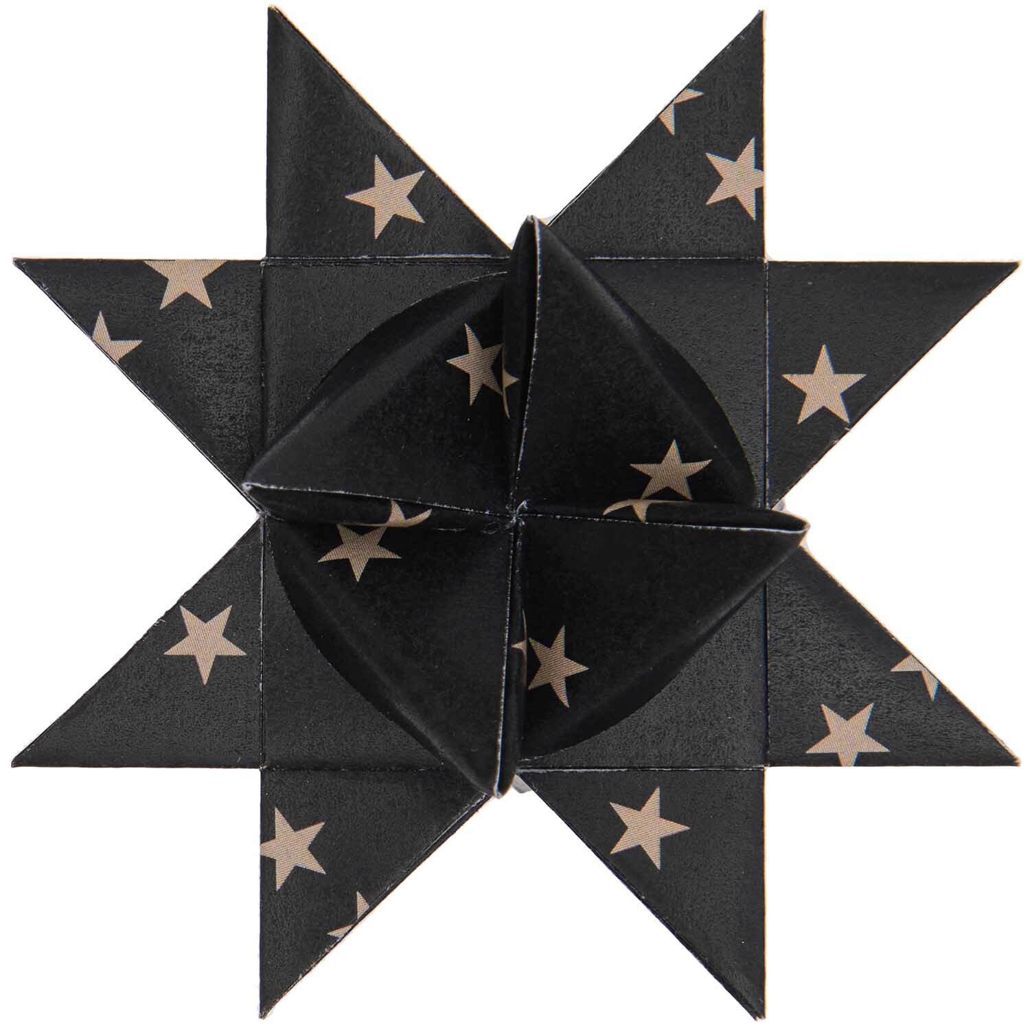 Paper Poetry Fröbelstreifen schwarz Sterne 60 Stück von Rico Design Paper Poetry Fröbelstreifen zeigt einen kunstvoll gefalteten schwarzen Stern mit weißen Sternmustern. Ideal für kreative Bastelprojekte.