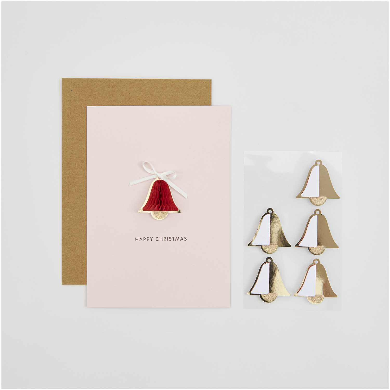 Paper Poetry Wabenpapiersticker Glocken 1 Blatt von Rico Design Paper Poetry Wabenpapiersticker Glocken 1 Blatt: Festliche Sticker in Gold und Weiß neben einer Weihnachtskarte mit roter Glocke.