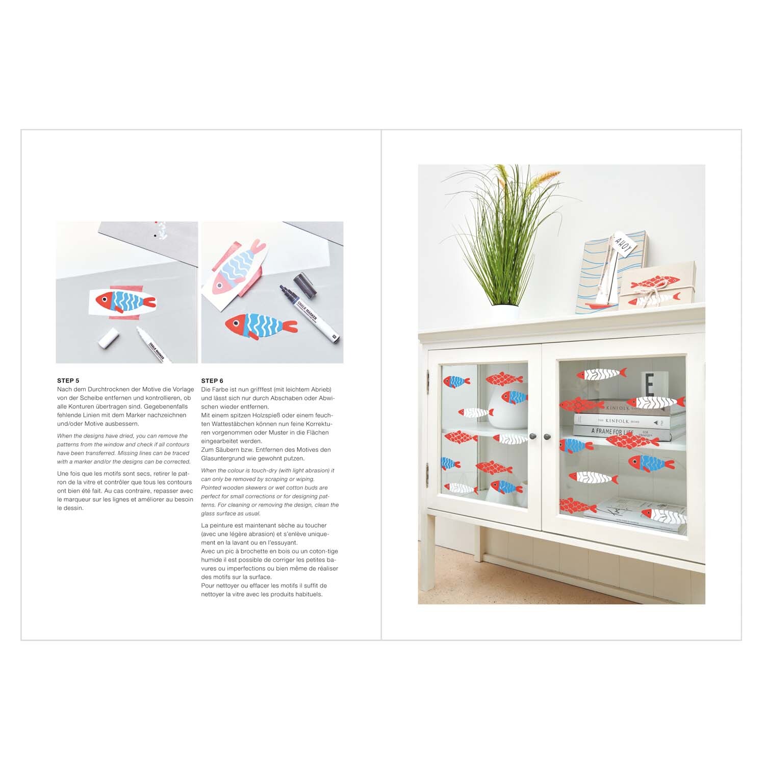 Vorlagenmappe Maritim Fenster- und Glasmalerei mit Kreidestiften zeigt bunte Fischmotive auf einem weißen Schrank. Ideal für kreative Dekorationen.
