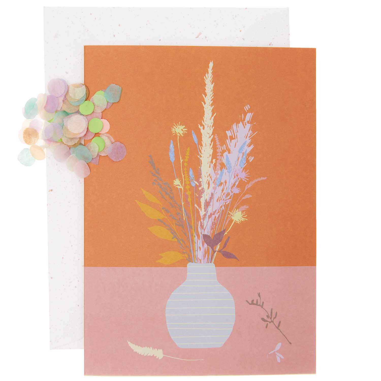 Paper Poetry Grußkartenset mit Blumenvase auf orangefarbenem Hintergrund, von Rico Design. Enthält bunte Konfetti und eine Karte mit floralen Motiven.